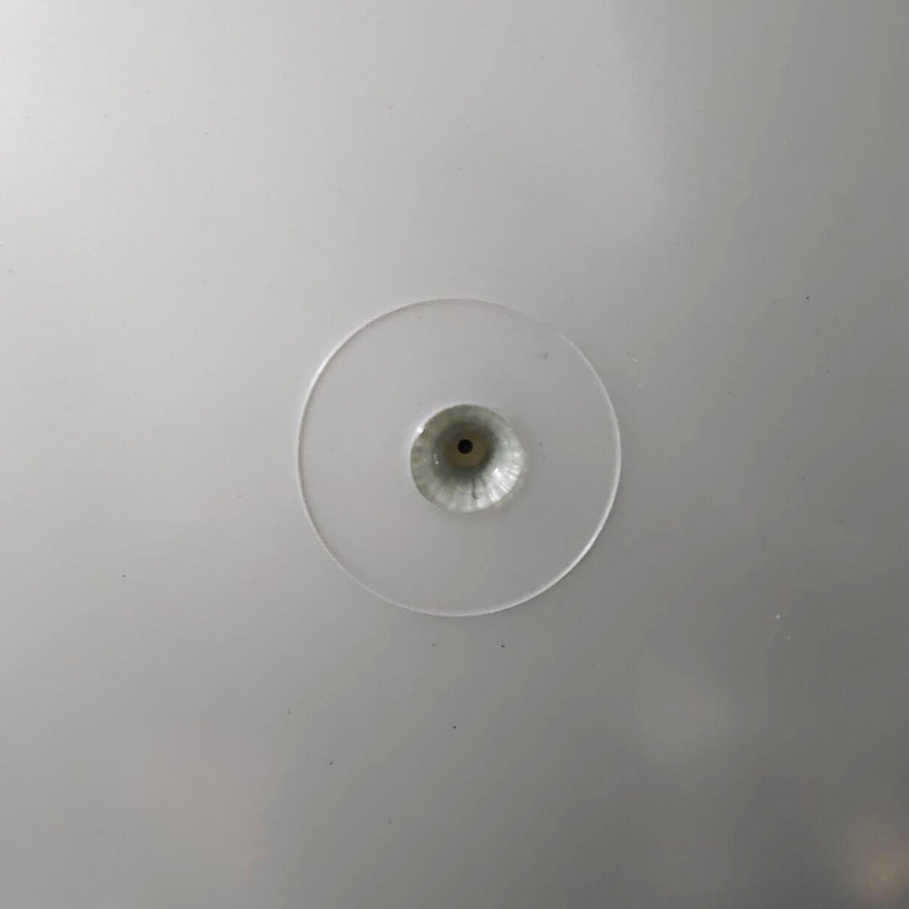 Close-up of the needle valve seated in the inner ball surface